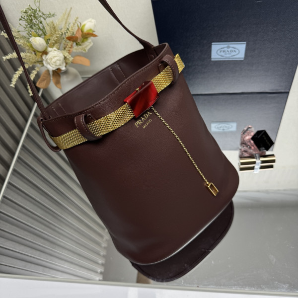 Pra*a buckle leather bucket bag with jeweled belt